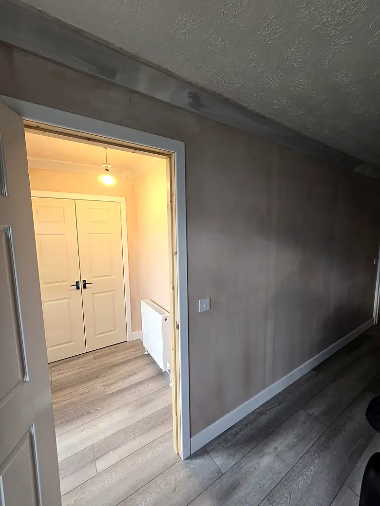 Hallway rebuilt with fresh plaster and new joinery